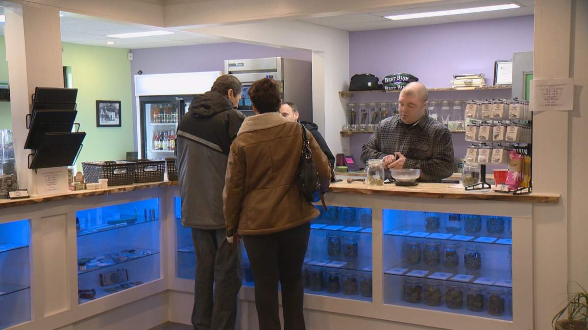 Pat Warnecke (right) bags cannabis at Best Buds Society.