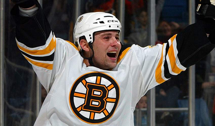 Marc Savard celebrates a goal with the Boston Bruins in 2009. Savard retired on Monday after 13 seasons in the NHL which was cut short in 2011 by a major concussion.