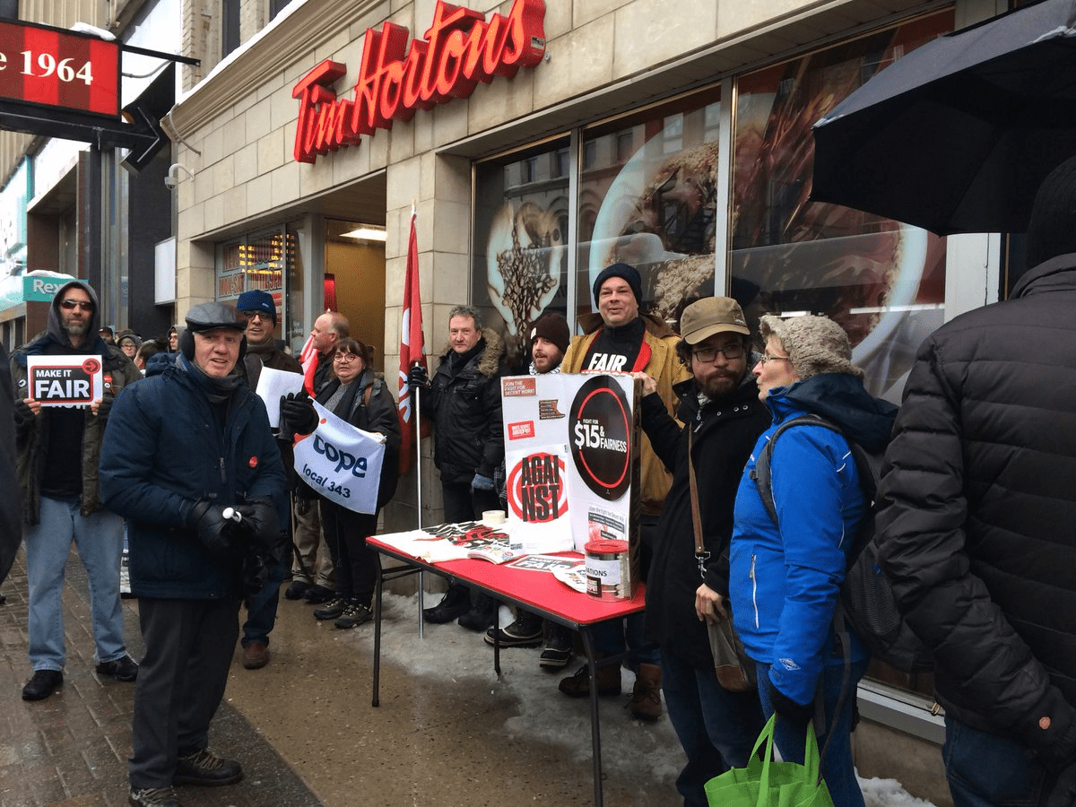 London labour activists protest outside Tim Hortons on Wednesday, Jan. 10.
