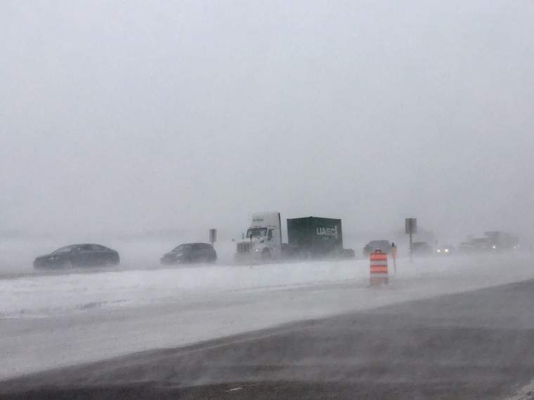Traffic is backed up on Highway #1 due to a jack-knifed semi.