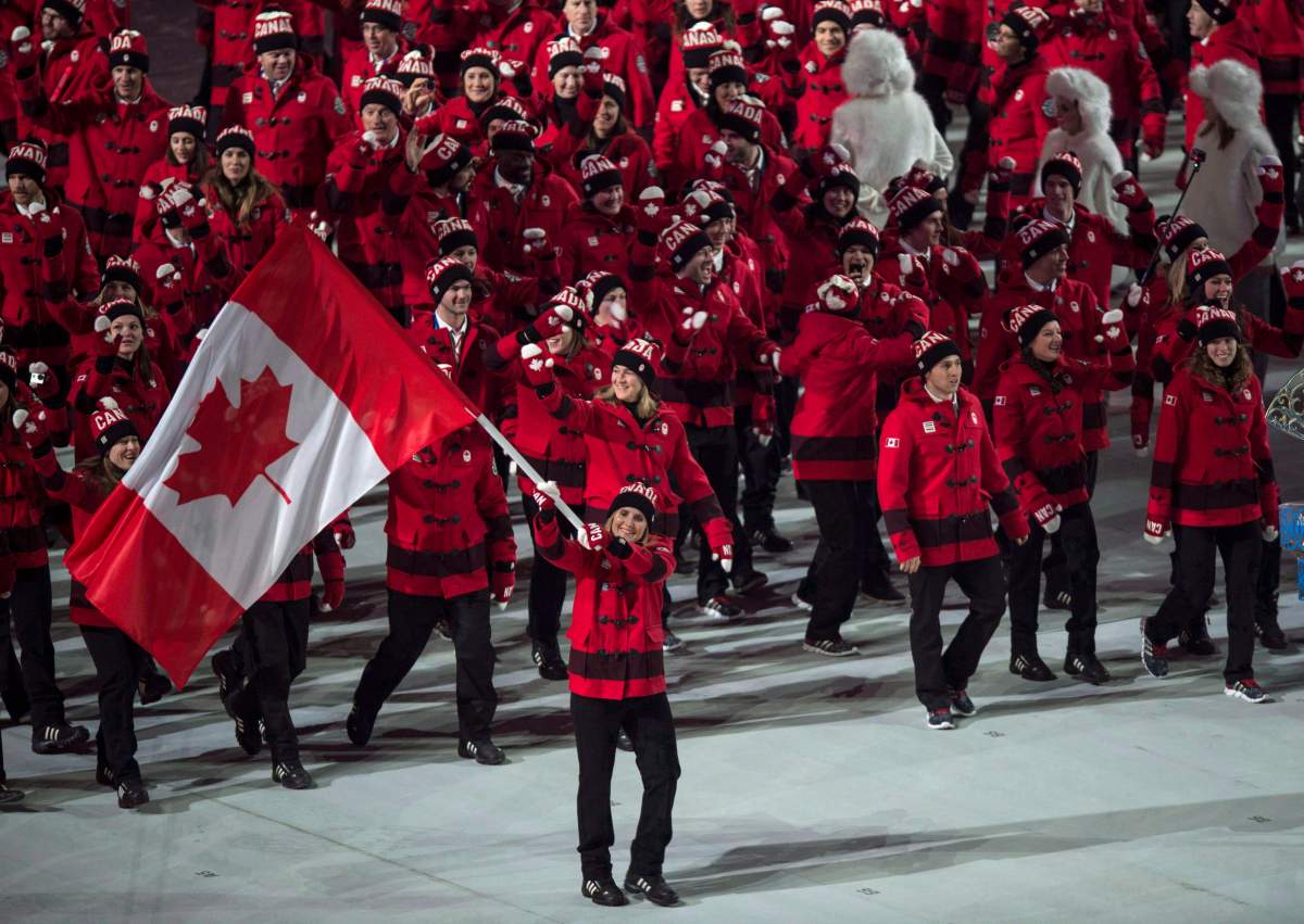 Hayley Wickenheiser leads the Canadian team into the stadium during opening ceremonies at the Sochi Winter Olympics in Sochi, Russia, on February 7, 2014.