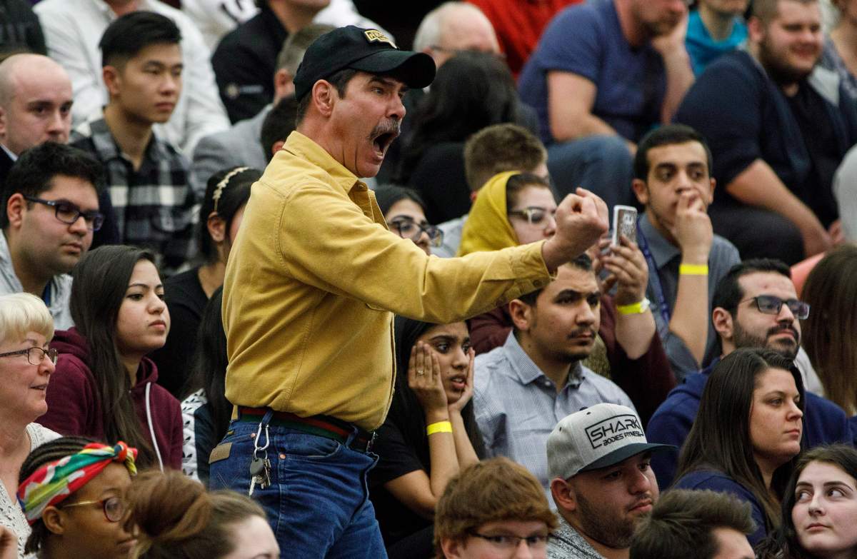 An angry spectator confronts Prime Minister Justin Trudeau during a town hall meeting in Edmonton on Thursday February 1, 2018.