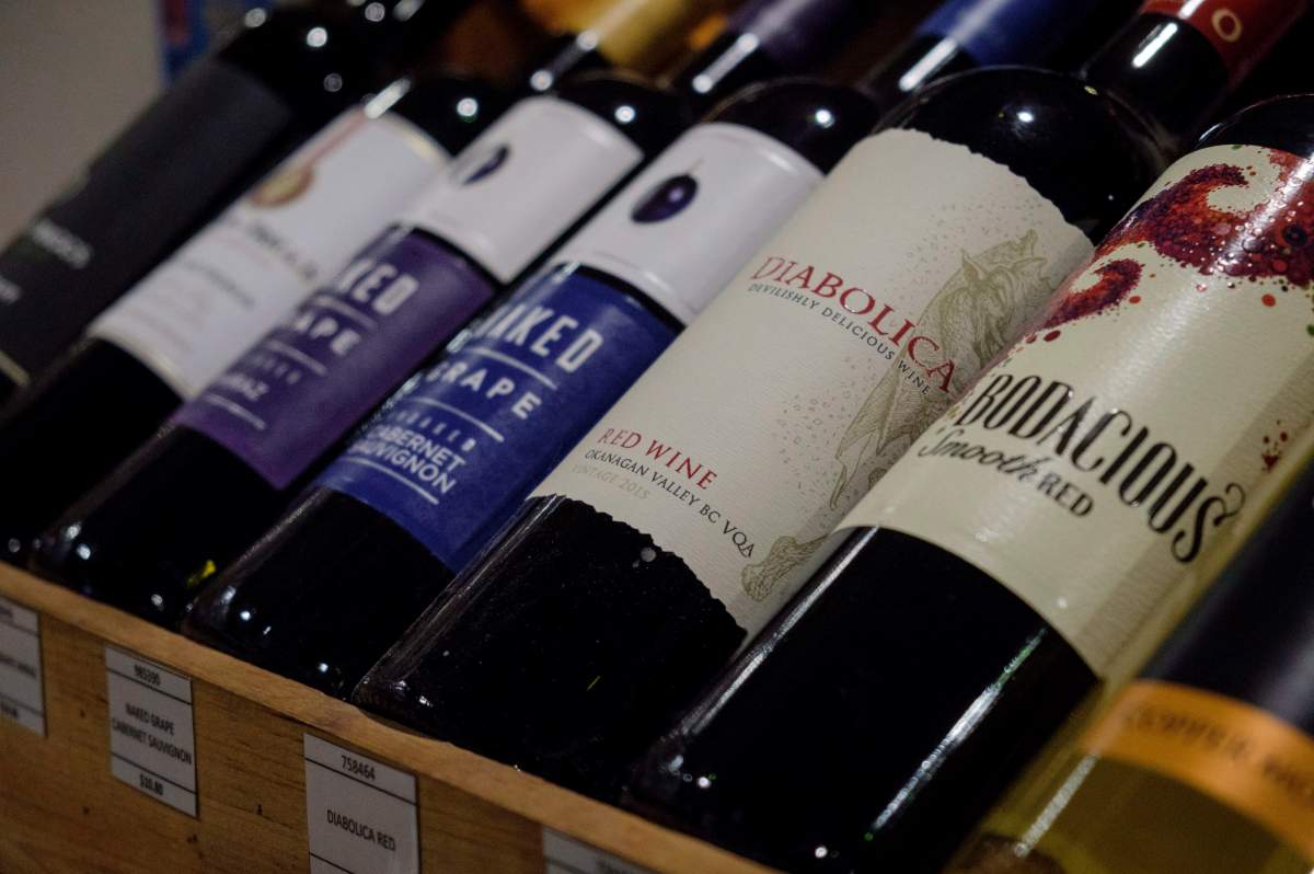 Bottles of British Columbia wine on display at a liquor store in Cremona, Alta., Wednesday, Feb. 7, 2018. Alberta is banning the import of British Columbia wines in response to what Alberta Premier Rachel Notley sees as moves to try to scuttle the Trans Mountain pipeline project. THE CANADIAN PRESS/Jeff McIntosh.