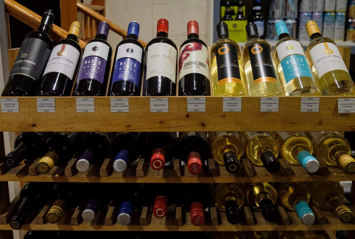 Bottles of British Columbia wine on display at a liquor store in Cremona, Alta., Wednesday, Feb. 7, 2018. Alberta is banning the import of British Columbia wines in response to what Alberta Premier Rachel Notley sees as moves to try to scuttle the Trans Mountain pipeline project. THE CANADIAN PRESS/Jeff McIntosh