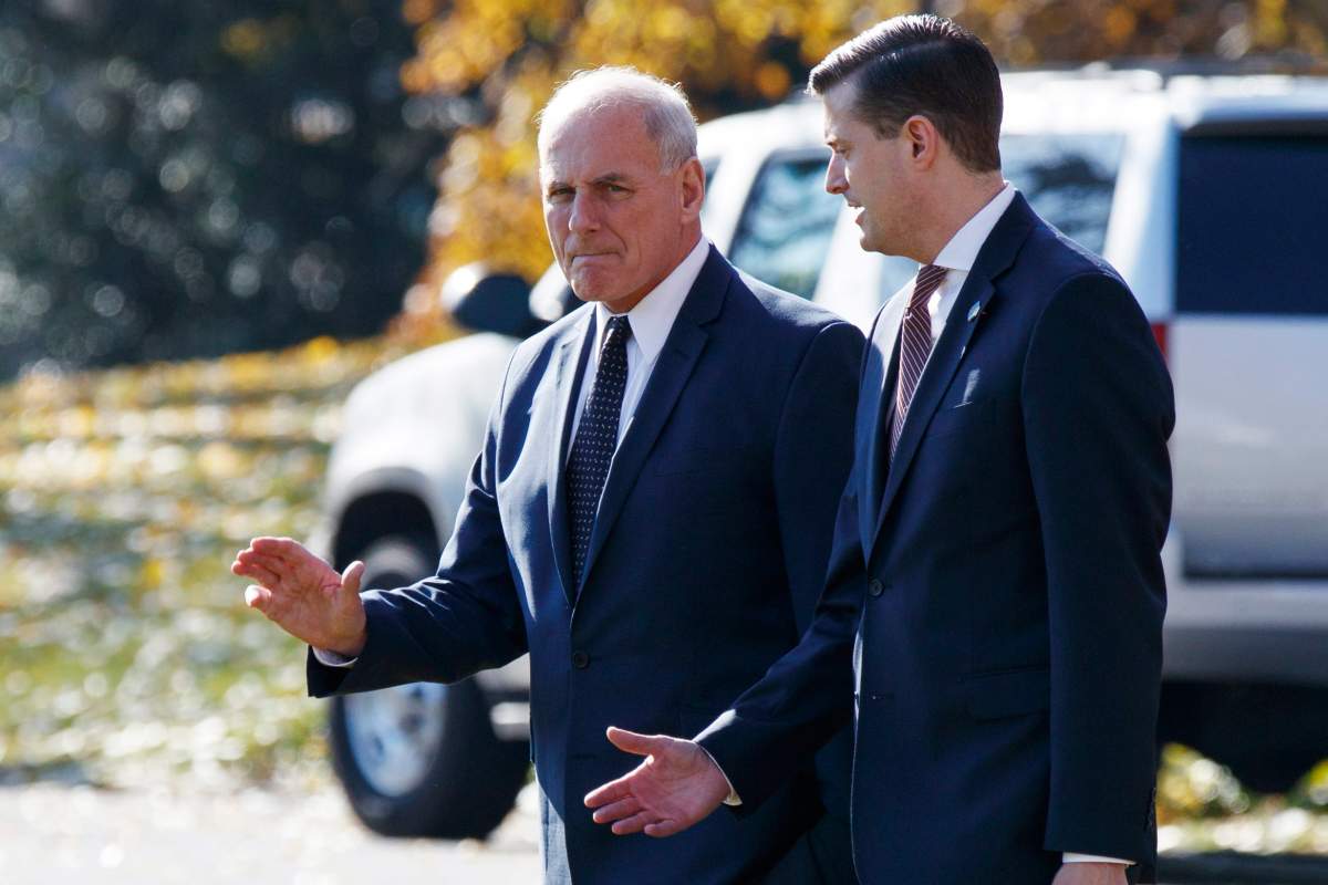 In this Nov. 29, 2017 file photo, White House Chief of Staff John Kelly, left, walks with White House staff secretary Rob Porter to board Marine One on the South Lawn of the White House in Washington. 