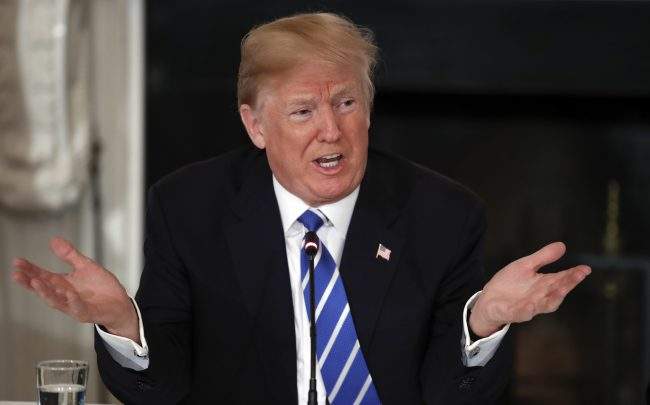 In this Feb. 12, 2018, photo, President Donald Trump speaks during a meeting with state and local officials about infrastructure in the State Dining Room of the White House in Washington. (AP Photo/Carolyn Kaster).