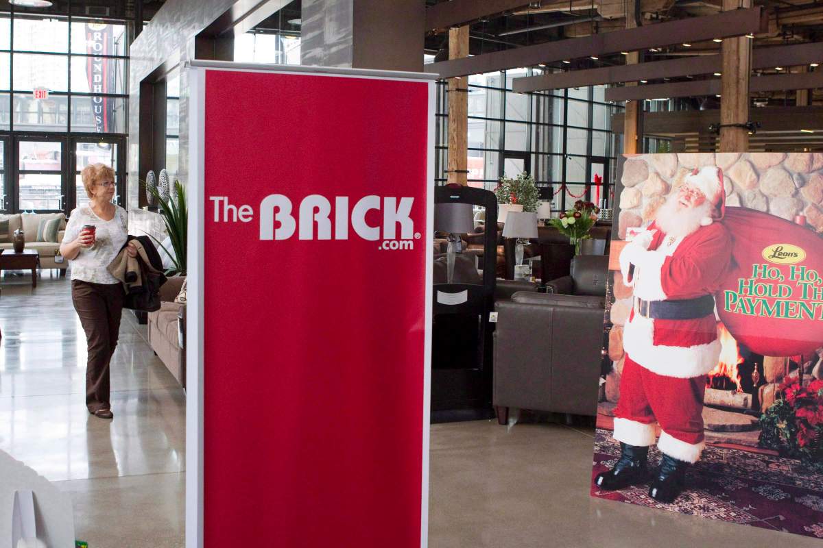 A customer walks through a Leon's store in Toronto on Monday November 12, 2012. Leon's Furniture announced that it is to purchase The Brick at an earlier news conference in the store.