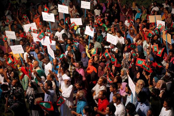 Opposition supporters protest against the government’s delay in releasing their jailed leaders on Feb. 4.