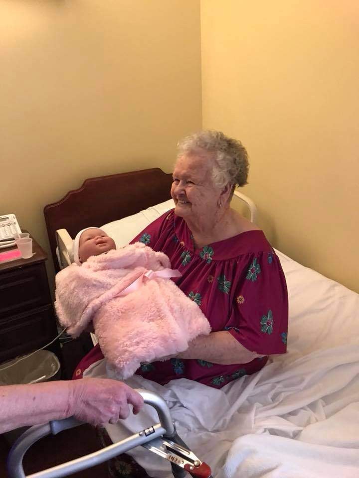 Alzheimer’s patients light up after receiving dolls and plush puppies for therapy - image