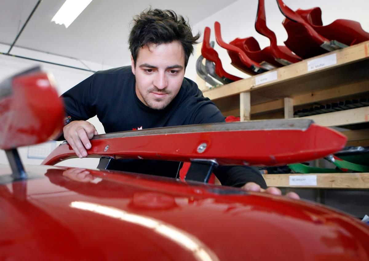 Luge athlete Sam Edny, works on his luge sled at the Canadian luge team's sled factory in Calgary, Tuesday, July 21, 2009.