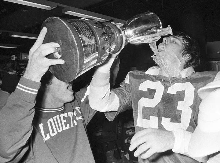 Montreal Alouettes' Tony Proudfoot drinks champagne from the Dixon Cup after winning the eastern conference championships in Montreal on Nov. 17, 1979. 
