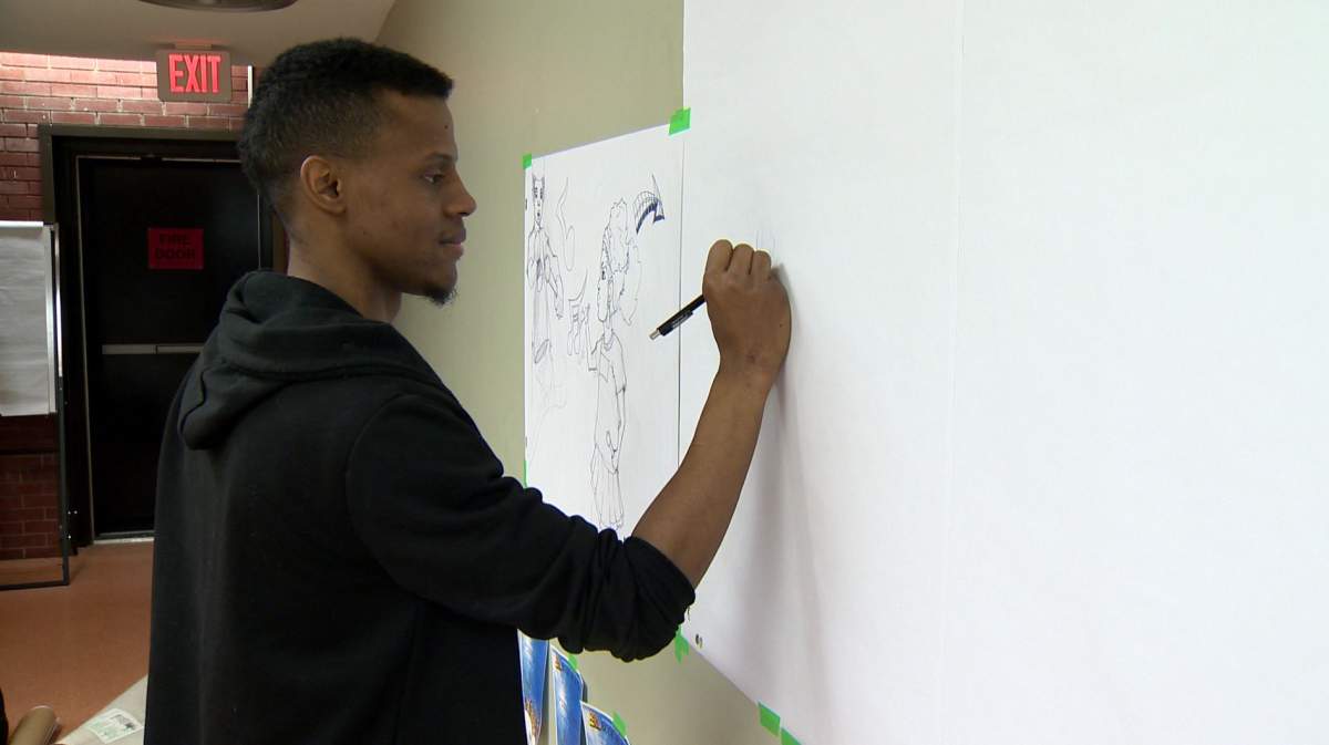 Artist Othell Downey drew different scenes of an event to create a book in a day that was held at Halifax North Memorial Public Library on Feb. 24, 2018.