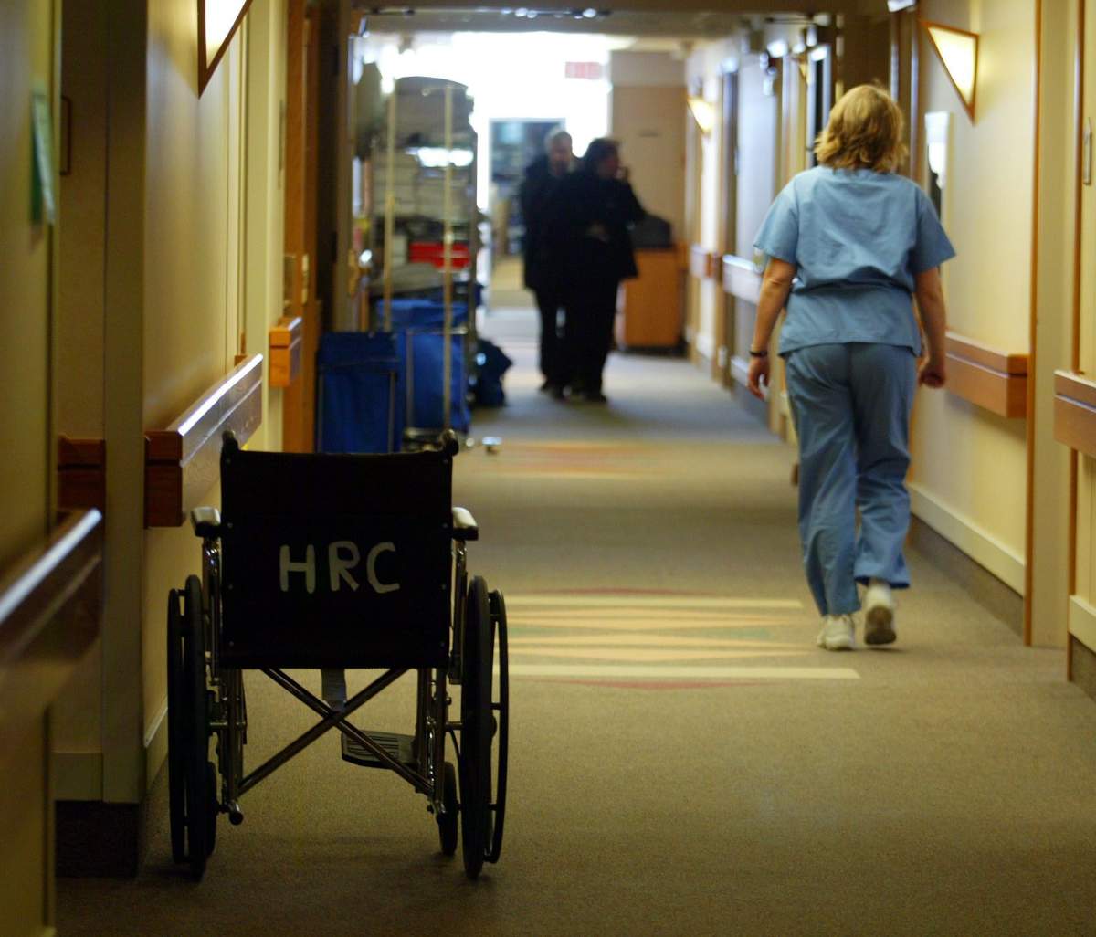 A nurse walks down a hallway at Calgary's former Grace Hospital, which is now a private health care facility, Wednesday, Jan 12, 2005. 