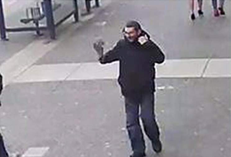 Police say the suspect fled north on Douglas Street and was seen changing his appearance as he went.