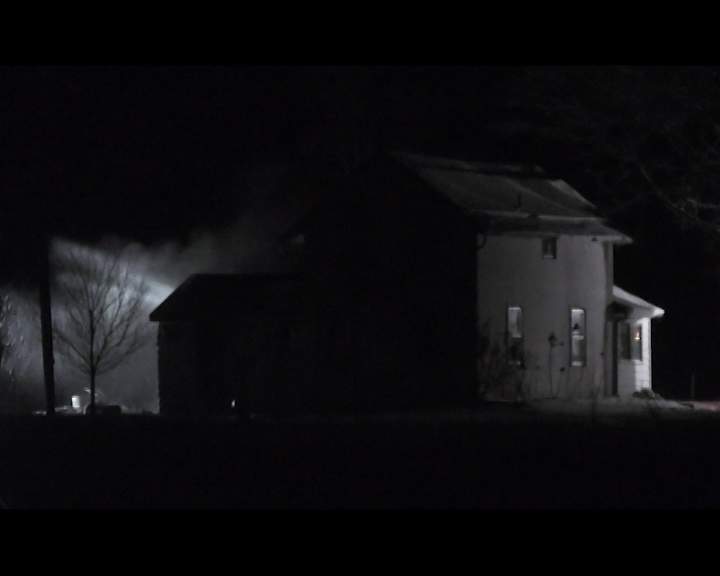 Firefighters tend to a farm house fire on Blackbird Road in the City of Kawartha Lakes.