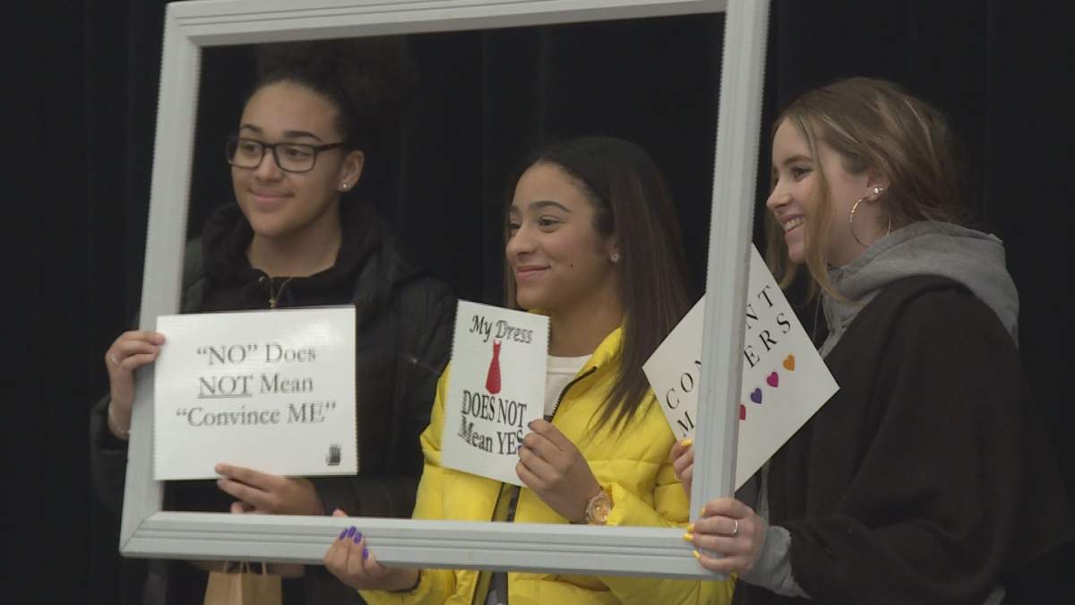 John Abbott College students pose at a photo booth at a consent workshop. Feb 7, 2018.
