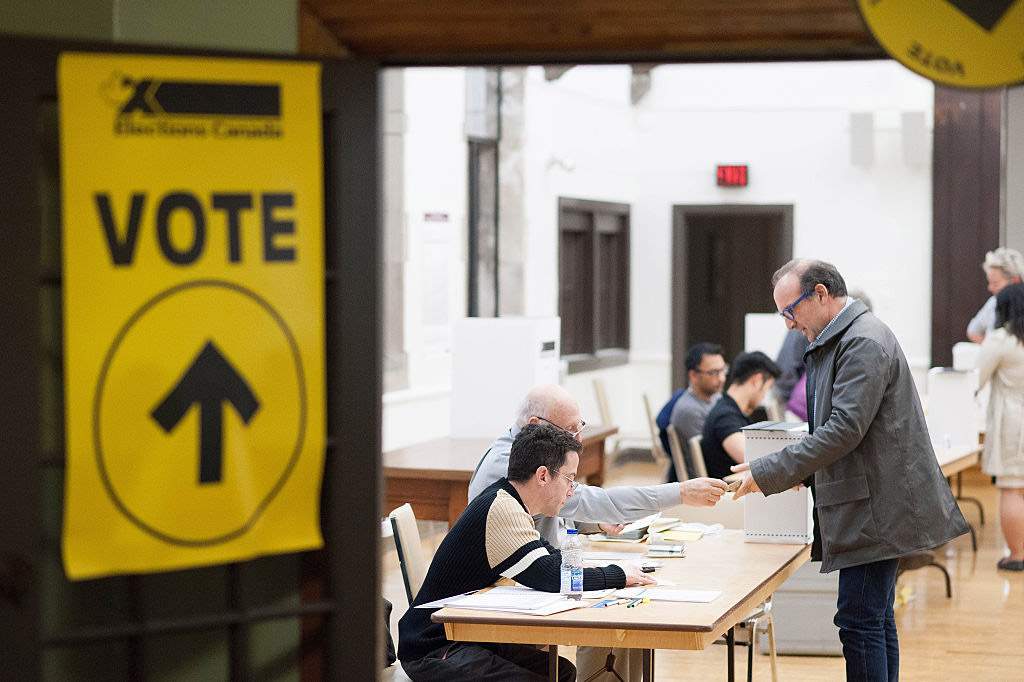 Voters in the 2015 federal election cast ballots in Toronto. 