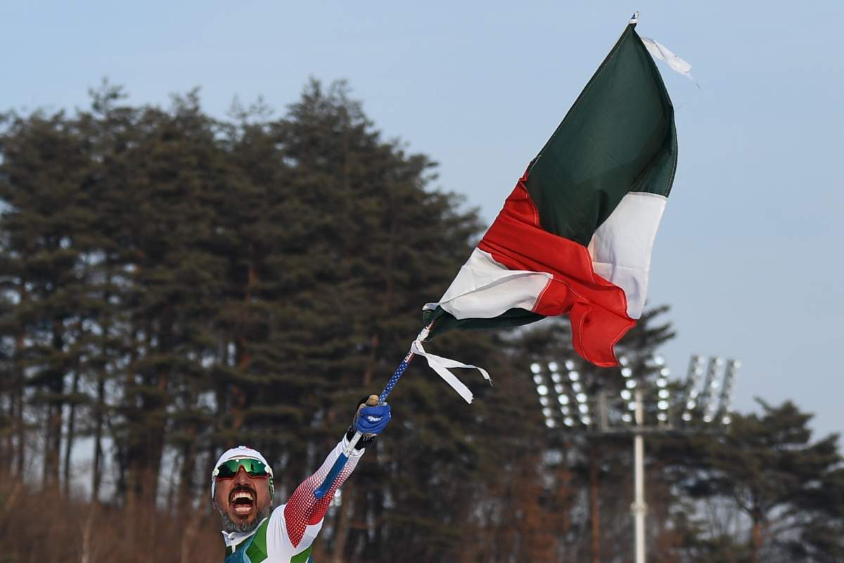 Madrazo celebrates after crossing the finish line at the 2018 Winter Olympic Games in Pyeongchang on Feb. 16, 2018.