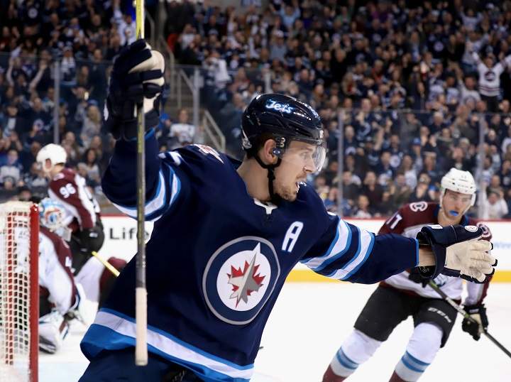 Mark Scheifele of the Winnipeg Jets celebrates after teammate Andrew Copp scores a second period goal against the Colorado Avalanche at Bell MTS Place on Feb. 16, 2018 in Winnipeg.