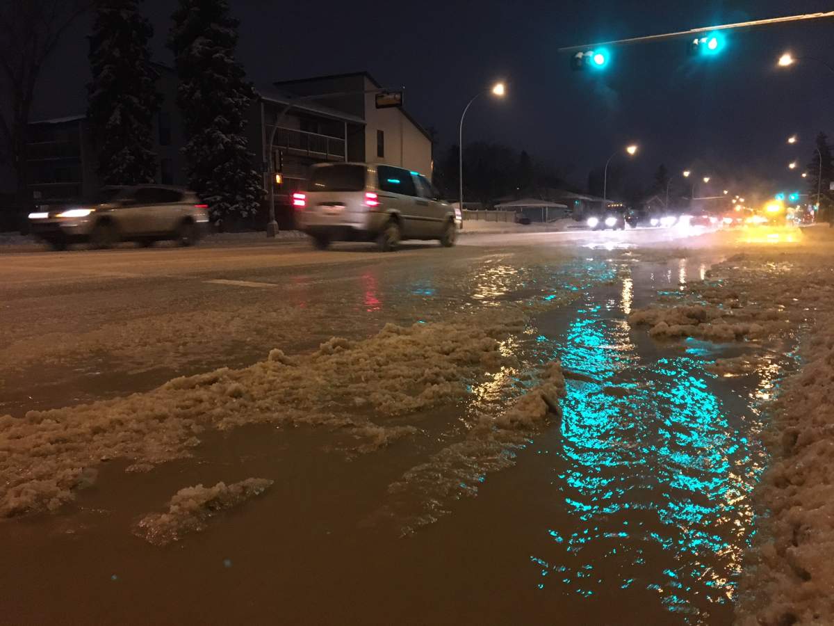 EPCOR crews responded to to 111 Avenue between 129 Street and 130 Street Wednesday morning, where water was flooding the road by the adjacent Westmount Junior High School. Edmonton, Alta. January 7, 2018.