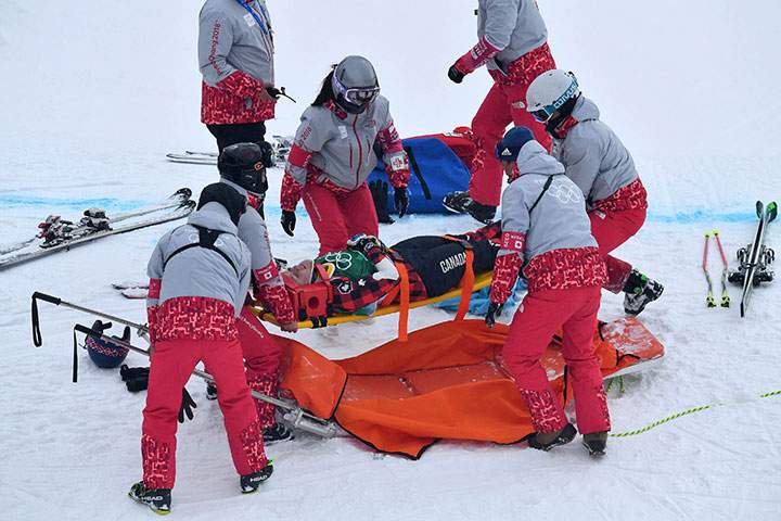 Canada’s India Sherret is carried off on a stretcher after she crashed during the women’s ski cross competition at Phoenix Snow Park, in Pyeongchang, South Korea on Feb. 23, 2018.