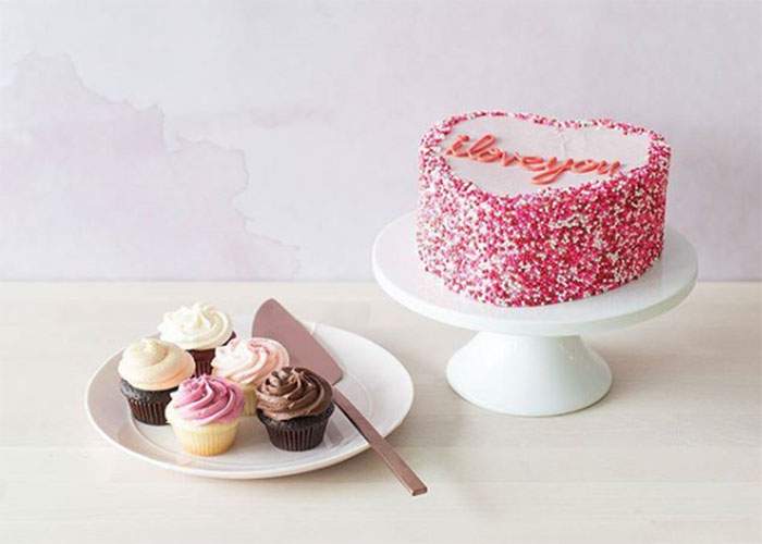 This Heartshaped cake is  available in either Chocolate or Vanilla, topped with Vava buttercream and Valentine's Day sprinkles!.