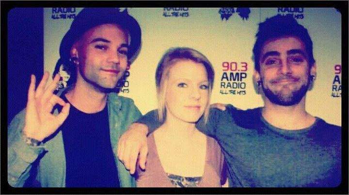 90.3 AMP Radio said this photo was taken of Katie Summers with Dave Rosin (left) and Jacob Hoggard (right) during Hedley’s visit to the Calgary station in 2011.