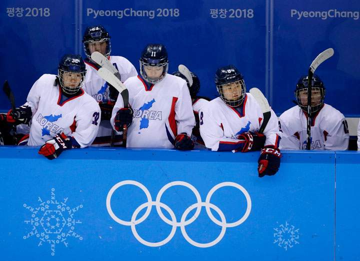 In this Feb. 18, 2018 file photo, North Korea's Jin Ok (32), of the combined Koreas team, joins teammates Park Yoonjung (23), Park Ye-eun (11), Kim Selin (8), and Kim Heewon (12) during the third period of the classification round of the women's hockey game at the 2018 Winter Olympics in Gangneung, South Korea.