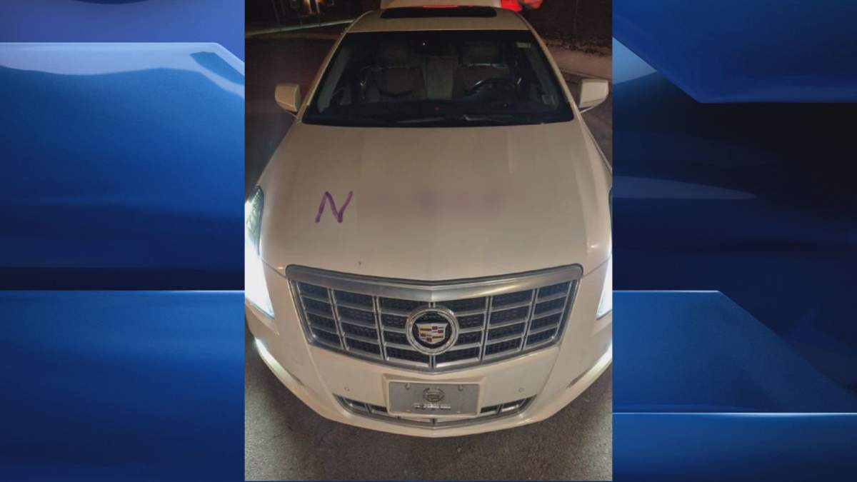 A censored version of a photo (inset) of Lance Spark’s car after it was defaced.