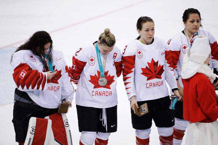 Jocelyne Larocque, (3), of Canada, holds her silver medal after losing to the United States in the women’s gold medal hockey game at the 2018 Winter Olympics in Gangneung, South Korea, Thursday, Feb. 22, 2018.
