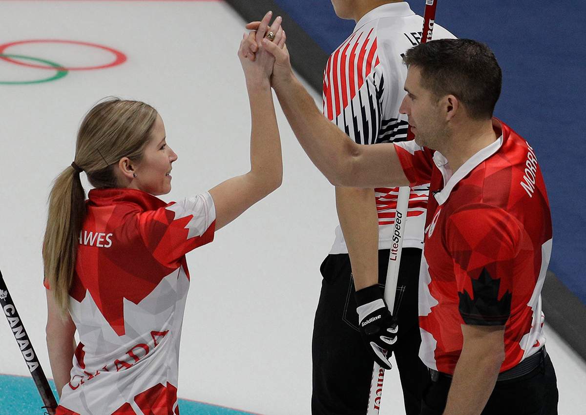 Canada’s Kaitlyn Lawes and John Morris reacts after winning their mixed doubles curling match against South Korea at the 2018 Winter Olympics in Gangneung, South Korea, Sunday, Feb. 11, 2018.