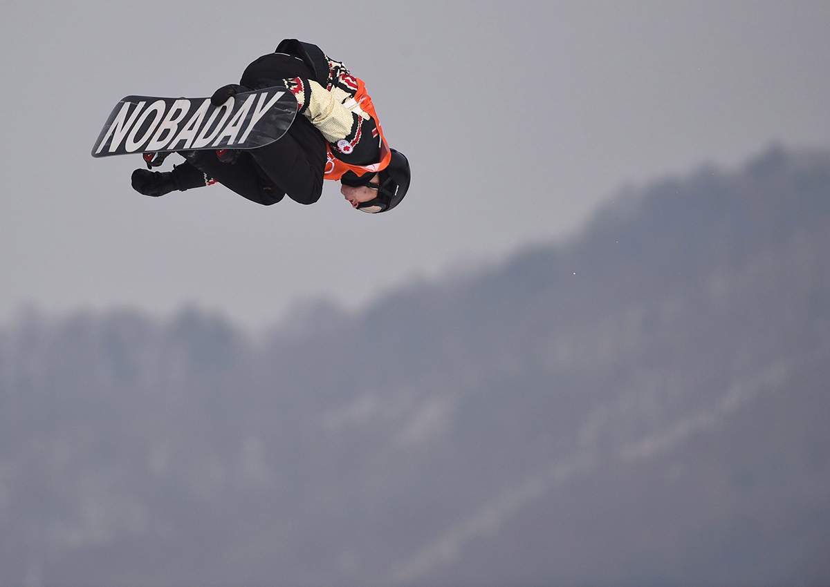 Canada’s Max Parrot of Bromont, Que. flies through the air during his second run in the men’s snowboard slopestyle qualification at the Phoenix Snow Park at the 2018 Winter Olympic Games in Pyeongchang, South Korea, Saturday, Feb. 10, 2018.