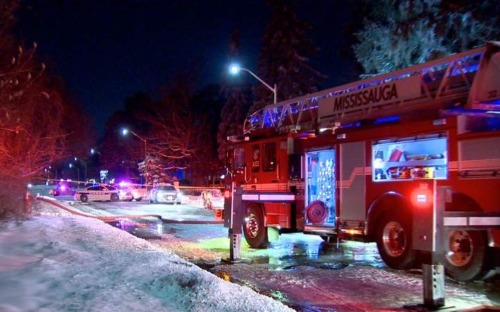 Firefighters battle a house fire in Mississauga on Feb. 8, 2018.