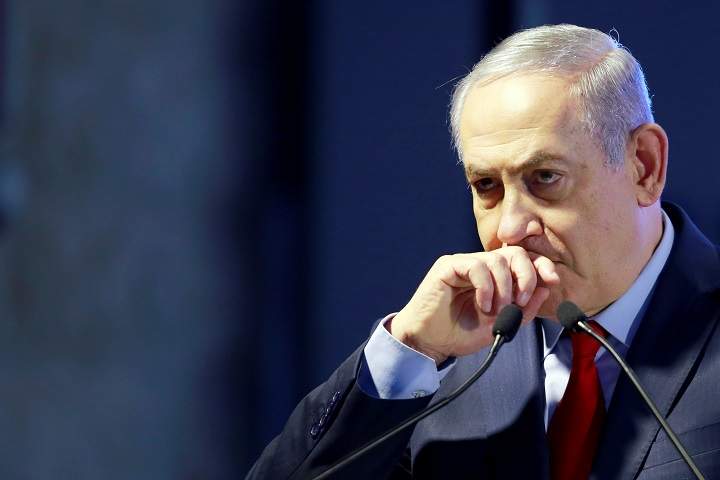 Israeli Prime Minister Benjamin Netanyahu speaks during an event in Ashkelon, southern Israel, February 20, 2018. Reports say a confidant of Netanyahu's has agreed to be a state witness in a corruption case against the leader.