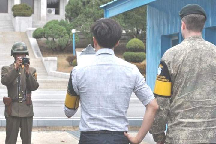 North Koreans filming a message at the DMZ.