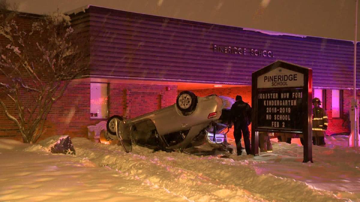Police at the scene of a rollover involving a stolen vehicle that happened outside Pineridge School Sunday night. 