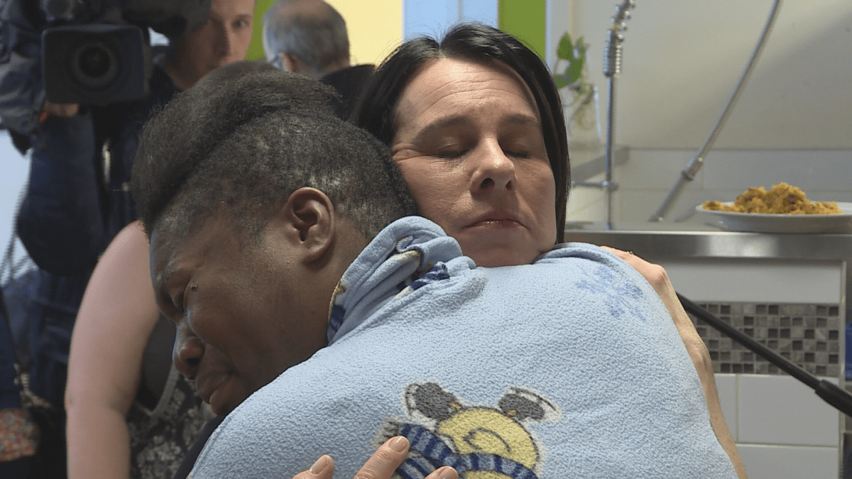 Montreal Mayor Valerie Plante embraces a woman during a press conference to announce funding for women's shelter.  Wednesday, Feb. 22, 2018.