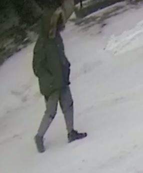 The suspect is described as thin with tan skin and brown eyes. He stands approximately 5 foot 9 inches to 5 foot 10 inches. He was wearing a balaclava, green parka with fur trim on the hoodie, grey pants and black running shoes.