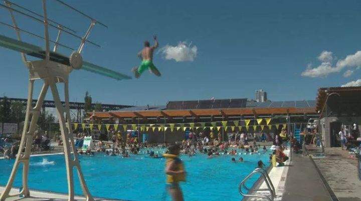 People enjoy the sun and water at Queen Elizabeth Outdoor Pool Tuesday, July 4, 2017.