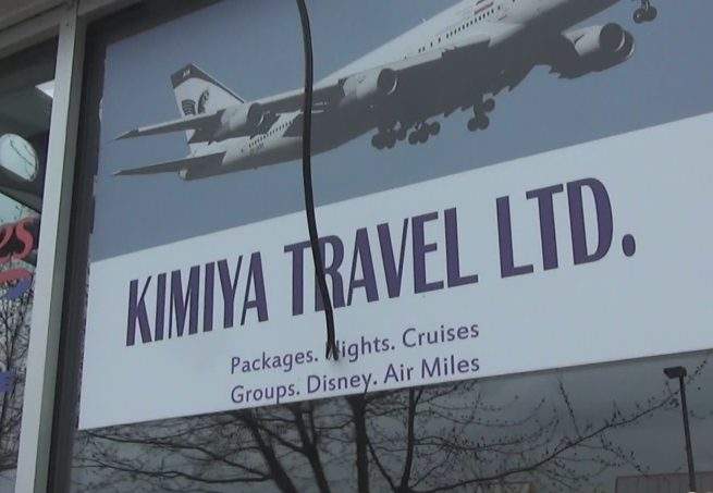 The storefront of Kimiya Travel, which appears to have suspended its phone number and email address.