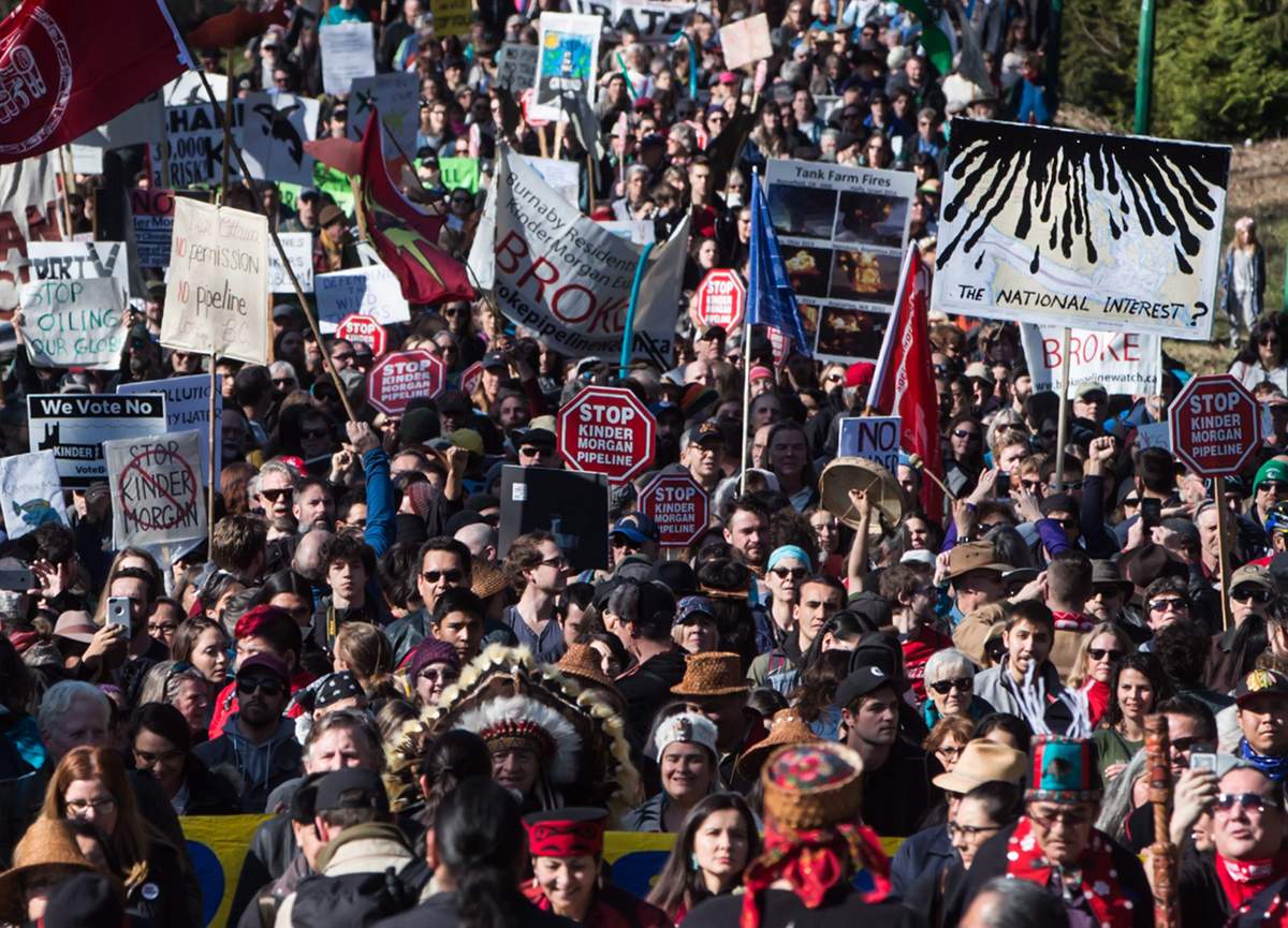 Thousands of people march together during a protest against the Kinder Morgan Trans Mountain pipeline expansion in Burnaby, B.C., on Saturday March 10, 2018.