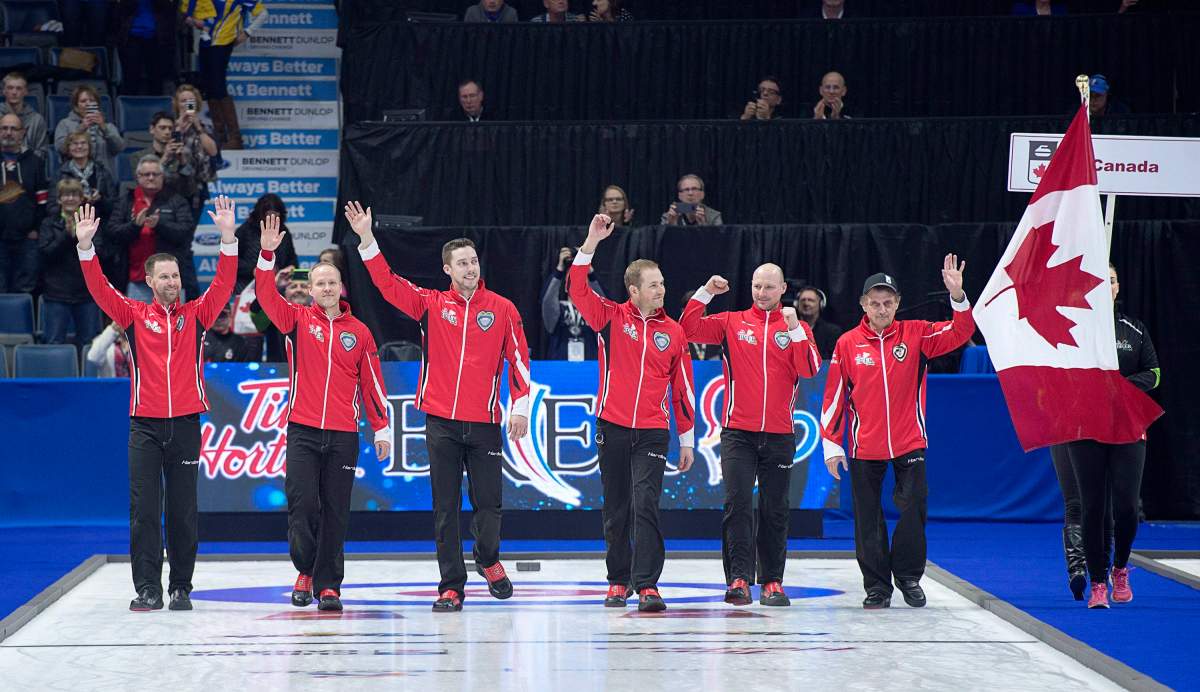 Team Canada skip Brad Gushue, third Mark Nichols, second Brett Gallant, lead Geoff Walker, alternate Tom Sallows and coach Jules Owchar, left to right, head down the sheet after defeating Alberta 6-4 to win the Tim Hortons Brier at the Brandt Centre in Regina on Sunday, March 11, 2018.