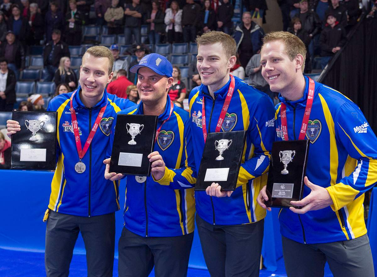 Alberta skip Brendan Bottcher, third Darren Moulding, second Brad Thiessen and lead Karrick Martin, left to right, pose with their hardware after losing to Team Canada at the Tim Hortons Brier at the Brandt Centre in Regina on Sunday, March 11, 2018.