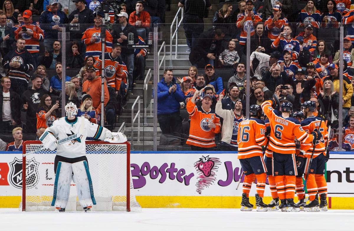 San Jose Sharks goaltender Martin Jones (31) looks on as the Edmonton Oilers celebrate a goal during first period NHL action in Edmonton, Alta., on Wednesday March 14, 2018.
