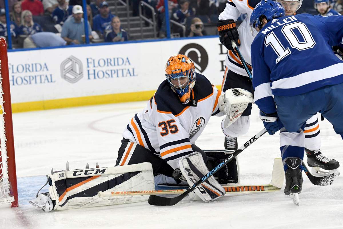 Edmonton Oilers goaltender Al Montoya (35) makes a save on a shot from Tampa Bay Lightning centre J.T. Miller (10) during the second period of an NHL hockey game Sunday, March 18, in Tampa, Fla.