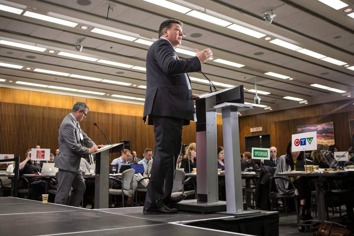 Provincial Finance Minister Charles Sousa takes questions from journalists during a pre-budget lock-up as the Ontario Provincial Government prepares to deliver its 2018 Budget at the Queens Park Legislature in Toronto on Wednesday March 28, 2018. THE CANADIAN PRESS/Chris Young.