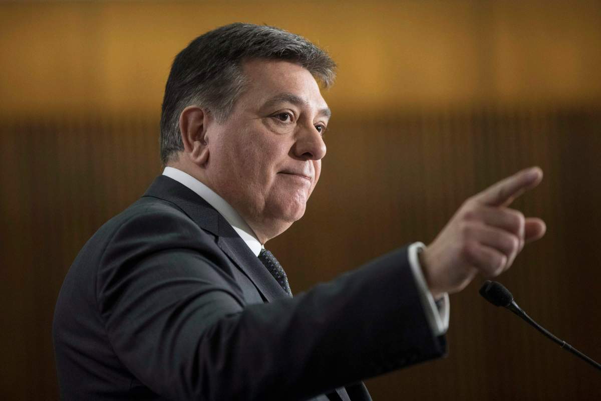 Provincial Finance Minister Charles Sousa takes questions from journalists during a pre-budget lock-up as the Ontario Provincial Government prepares to deliver its 2018 Budget at the Queens Park Legislature in Toronto on Wednesday March 28, 2018.