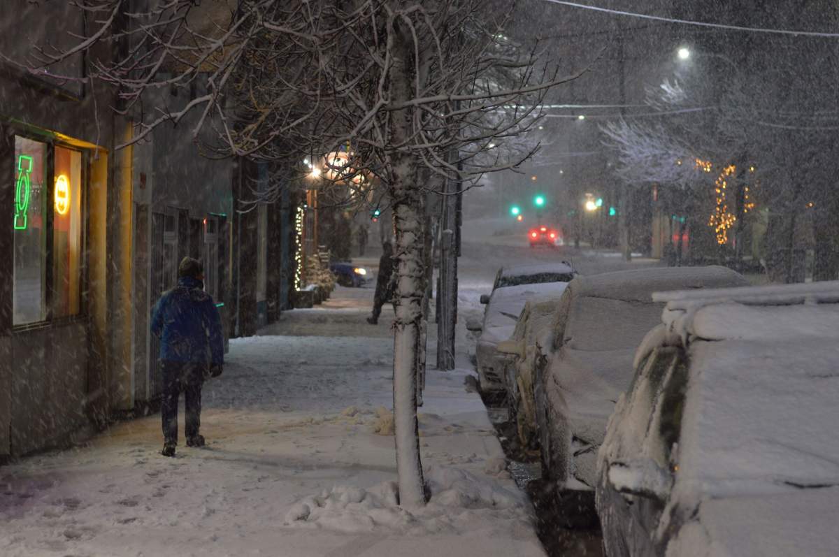 A man makes his way down Gottingen Street in Halifax during a snow storm on March 10, 2018.