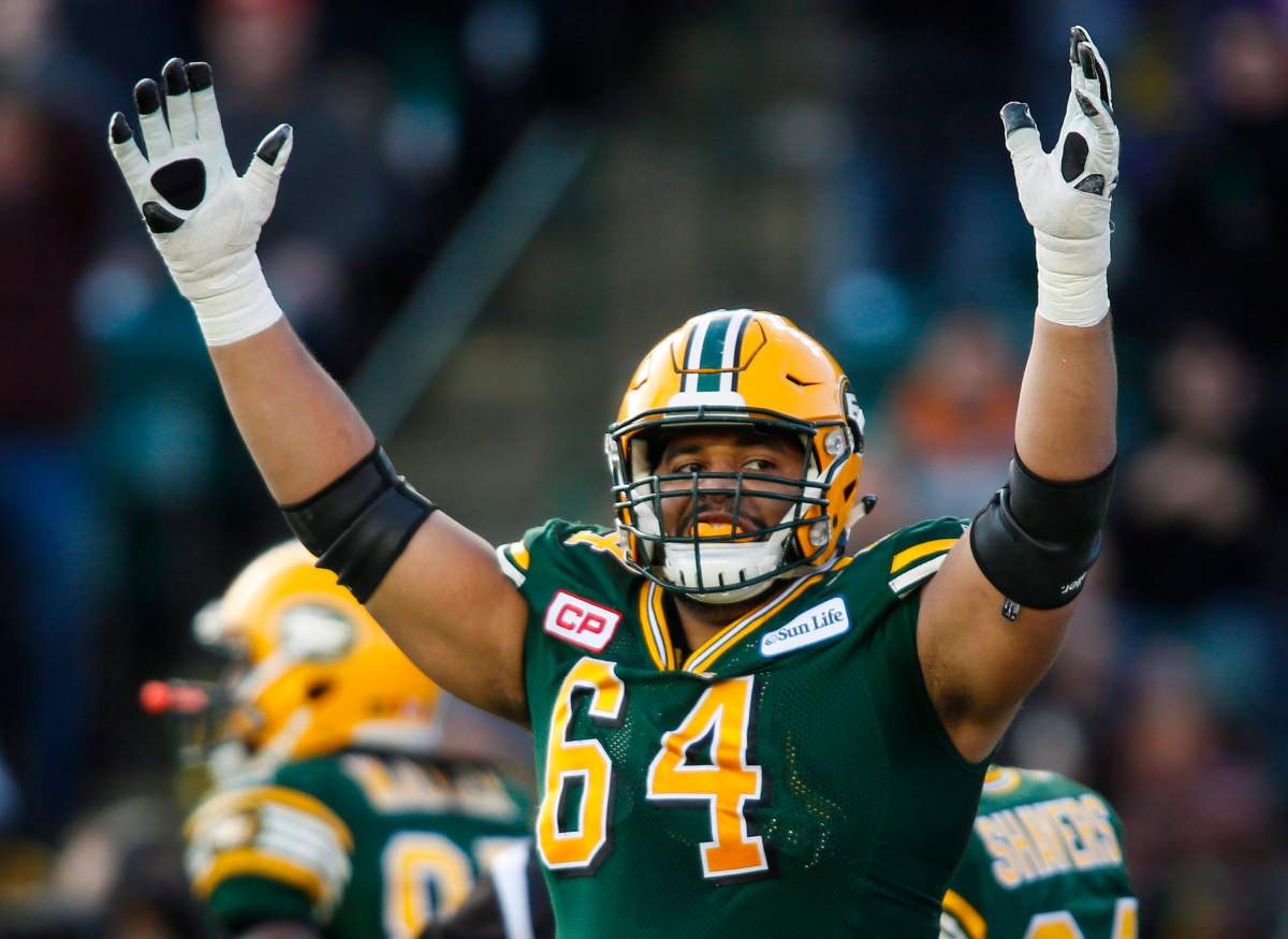 Edmonton Eskimos' Andrew Jones celebrates a touchdown during first half CFL West Division final football action against the Calgary Stampeders in Edmonton, Sunday, Nov. 22, 2015.