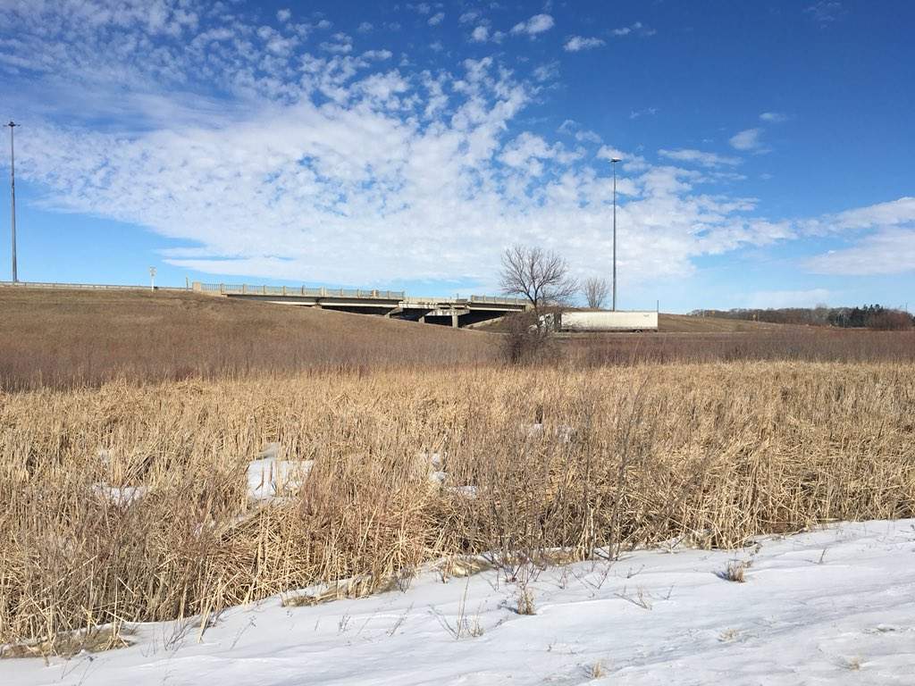 A truck drives under the Highway 1 overpass west of Portage la Prairie that will eventually be replaced.